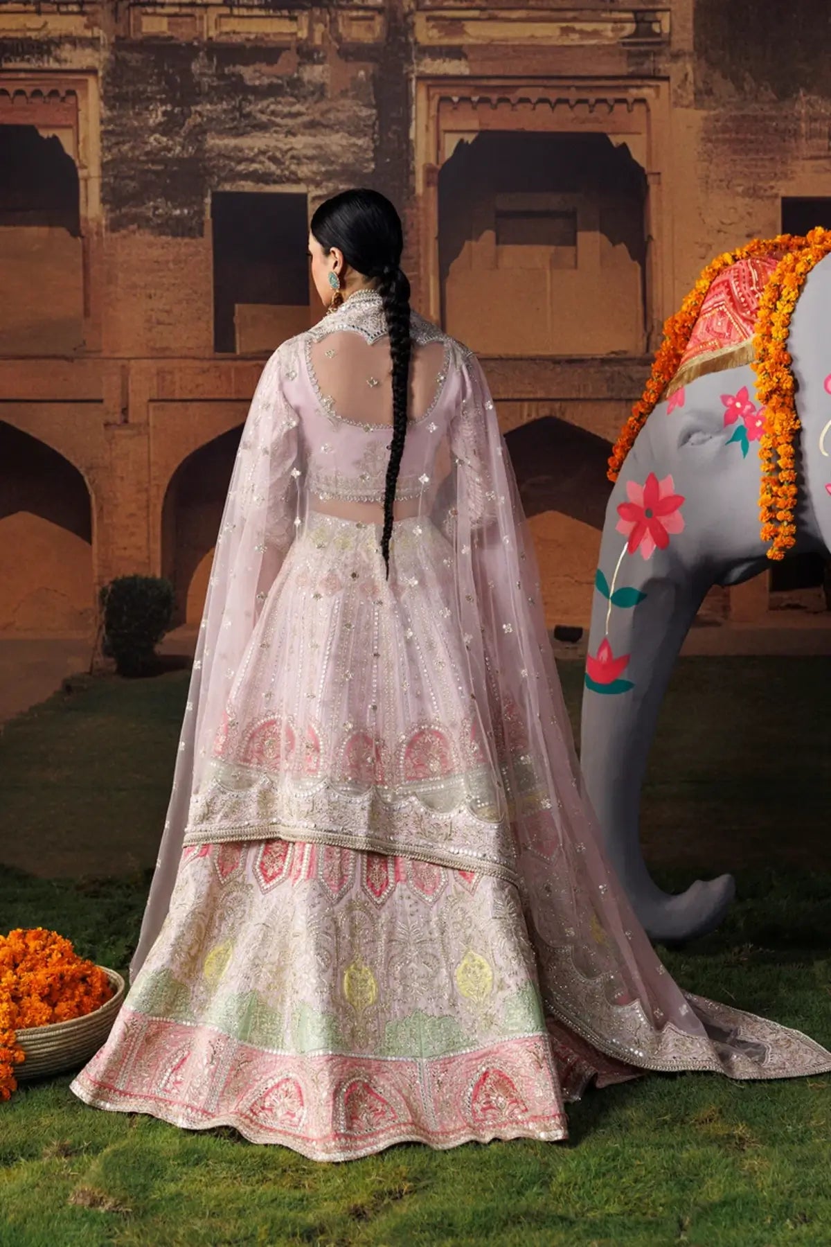 Gul-e-Roshan baby pink embroidered raw silk stitched lehenga choli with silver detailing and an elegant embellished poly net dupatta