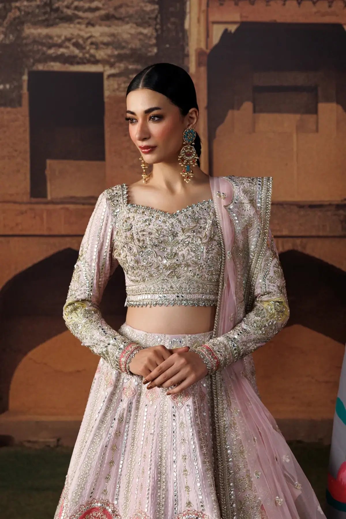 Gul-e-Roshan baby pink embroidered raw silk stitched lehenga choli with silver detailing and an elegant embellished poly net dupatta