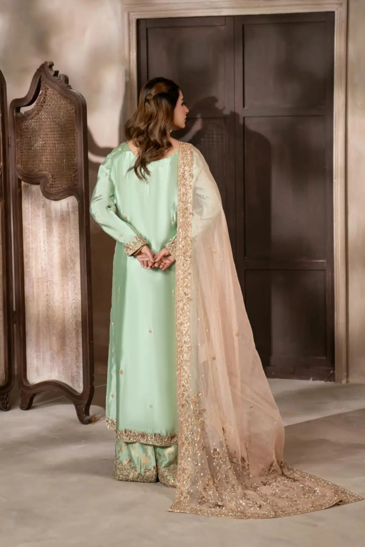 Gulbahar mint green handworked Sheesha silk formal suit with peach organza dupatta by MariamRaj
