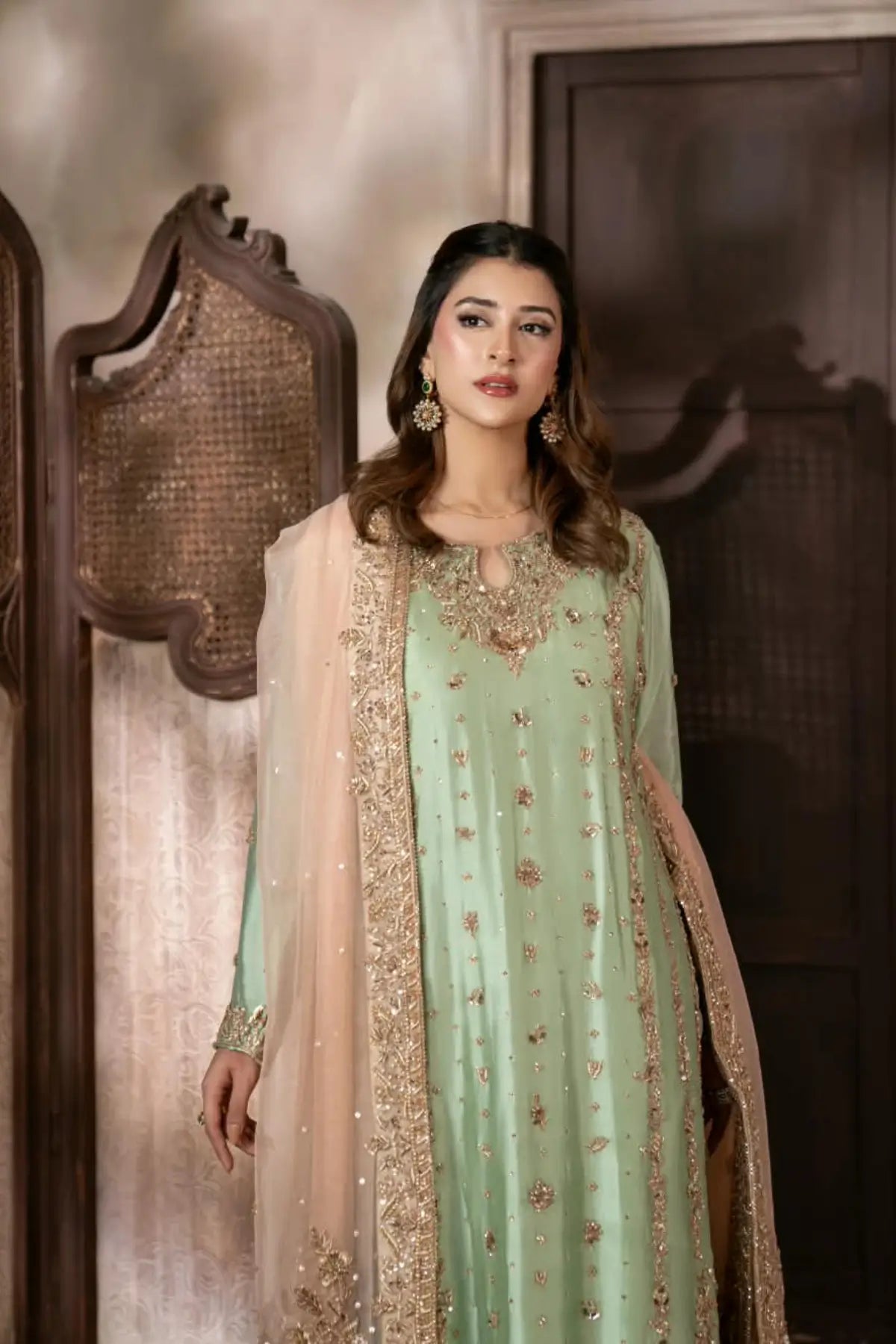 Gulbahar mint green handworked Sheesha silk formal suit with peach organza dupatta by MariamRaj