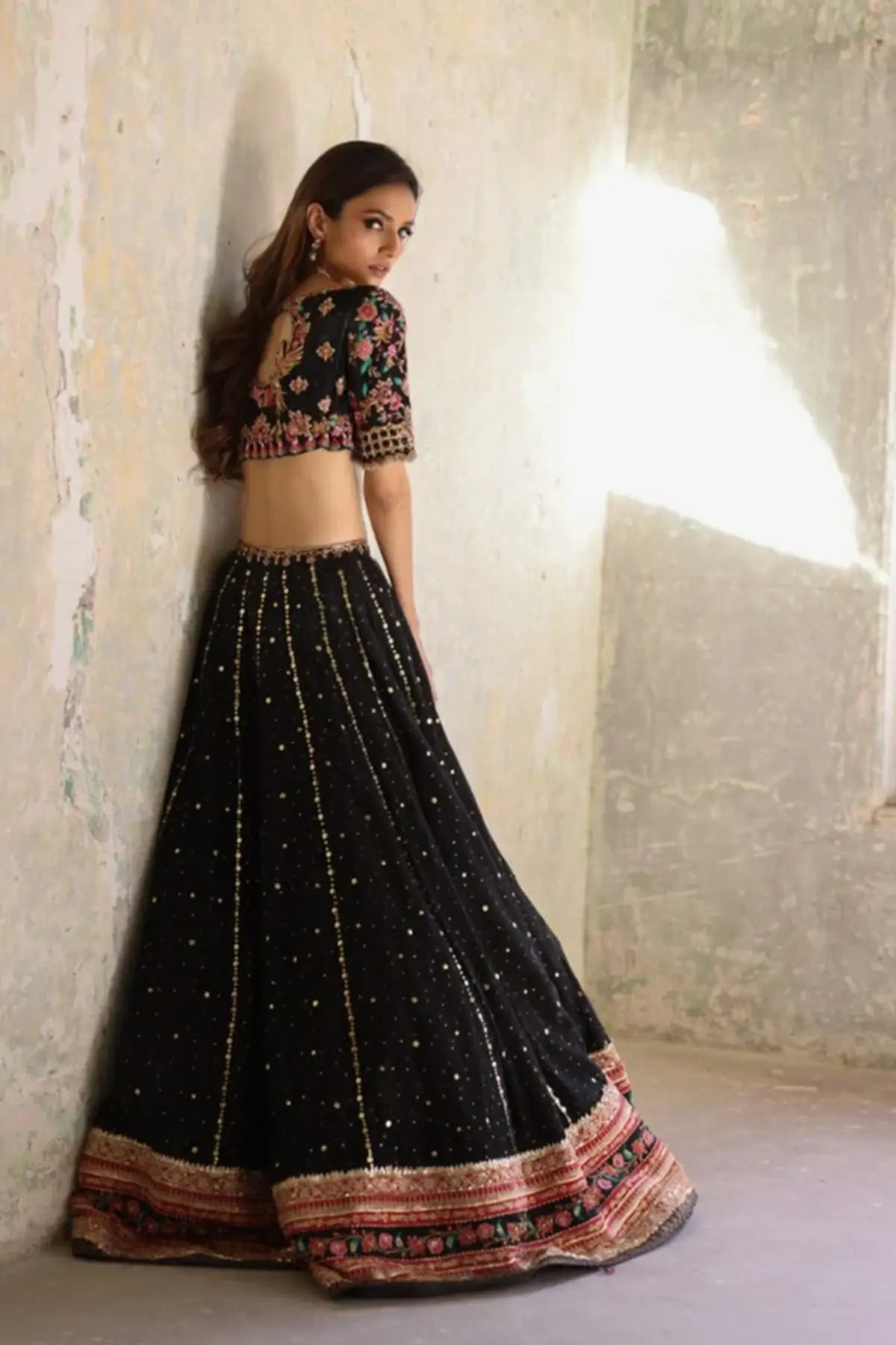 Gulnaaz Black Gold Embroidered Cotton Net Pakistani Formal Lehenga Choli with Pink Firozi Floral Details and Lame Dupatta