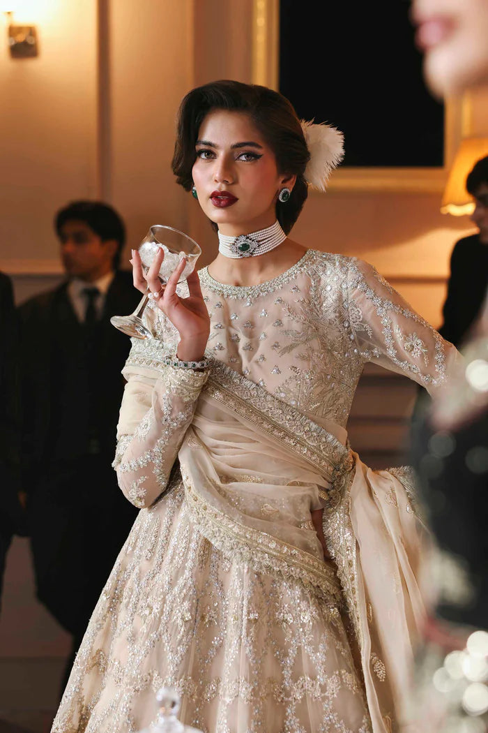 Gulnisa ivory organza hand embroidered bridal pishwas with dupatta by Akbar Aslam, luxury couture for Pakistani brides at weddings and receptions.