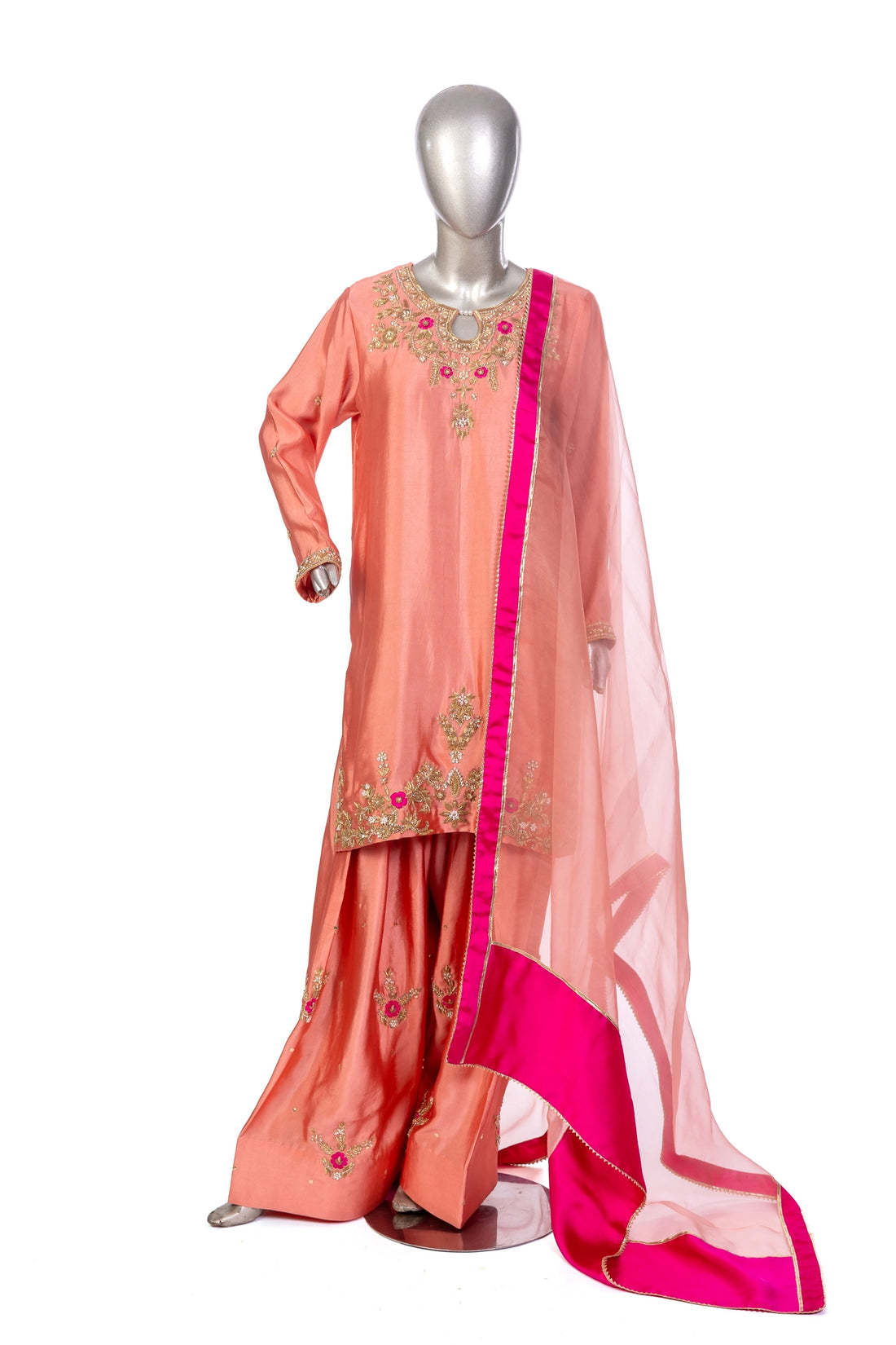 Hiba Peach Sheesha Silk Suit with resham & gota work, organza dupatta and silk border. Shop MariamRaj designer outfits at Pakistanimoda.
