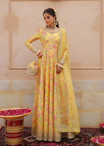 Hoorain bright yellow screen-printed pishwas with embroidered neckline, churidaar pajama, and dupatta by Kanwal Malik from the Saheli Luxury Pret Collection.