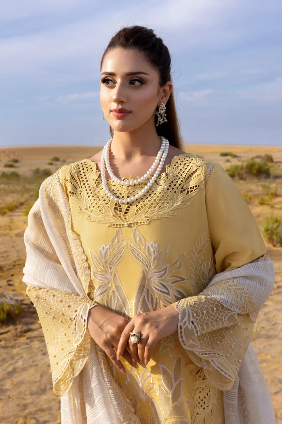 Rang Rasiya Hoorain yellow lawn outfit featuring schiffli and cutwork accents