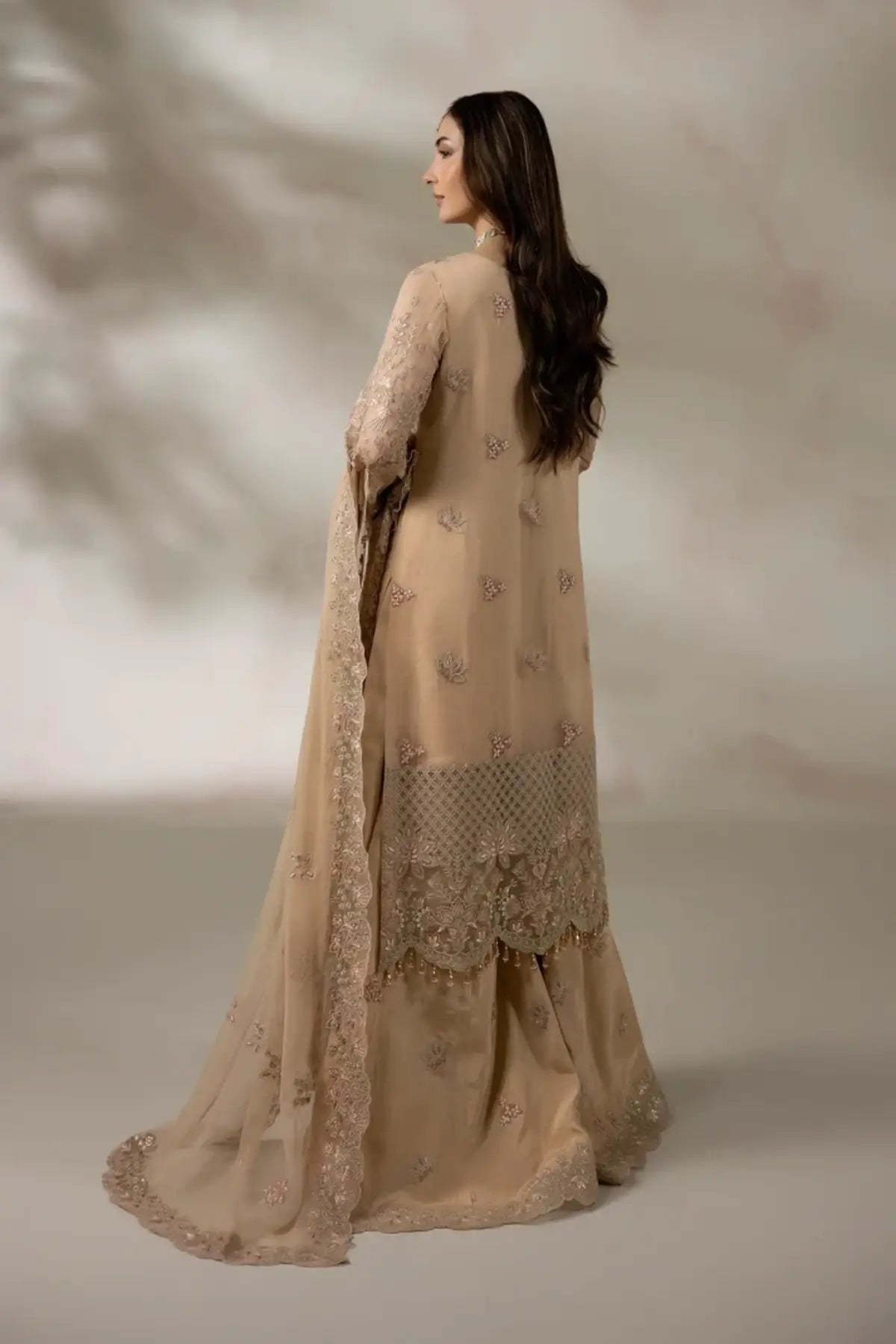 I-285 Chantilly by Imrozia, skin peach embroidered chiffon stitched suit with raw silk trouser and chiffon dupatta.