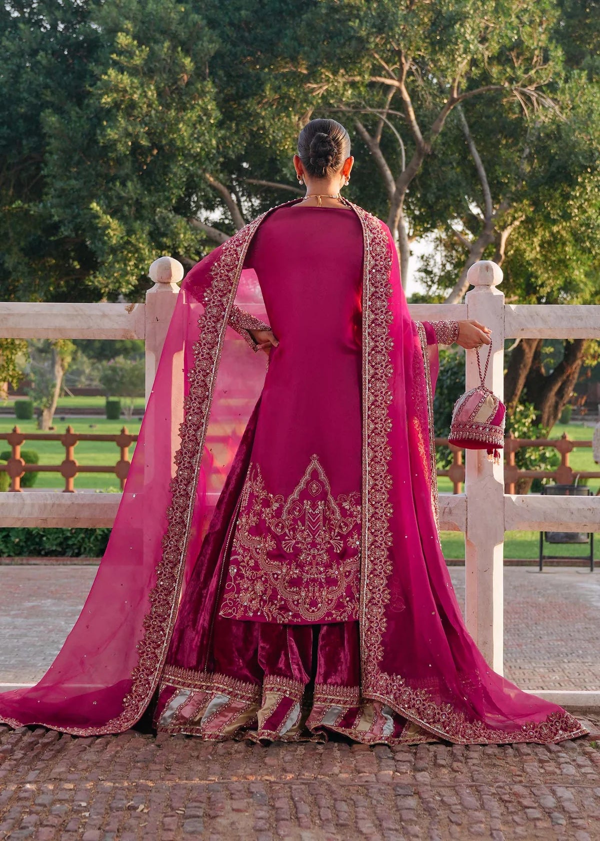 INAZAR – Fuchsia bridal lehenga suit with velvet lehenga, silk shirt, and embroidered dupatta. Stitched wedding outfit online at Pakistanimoda.