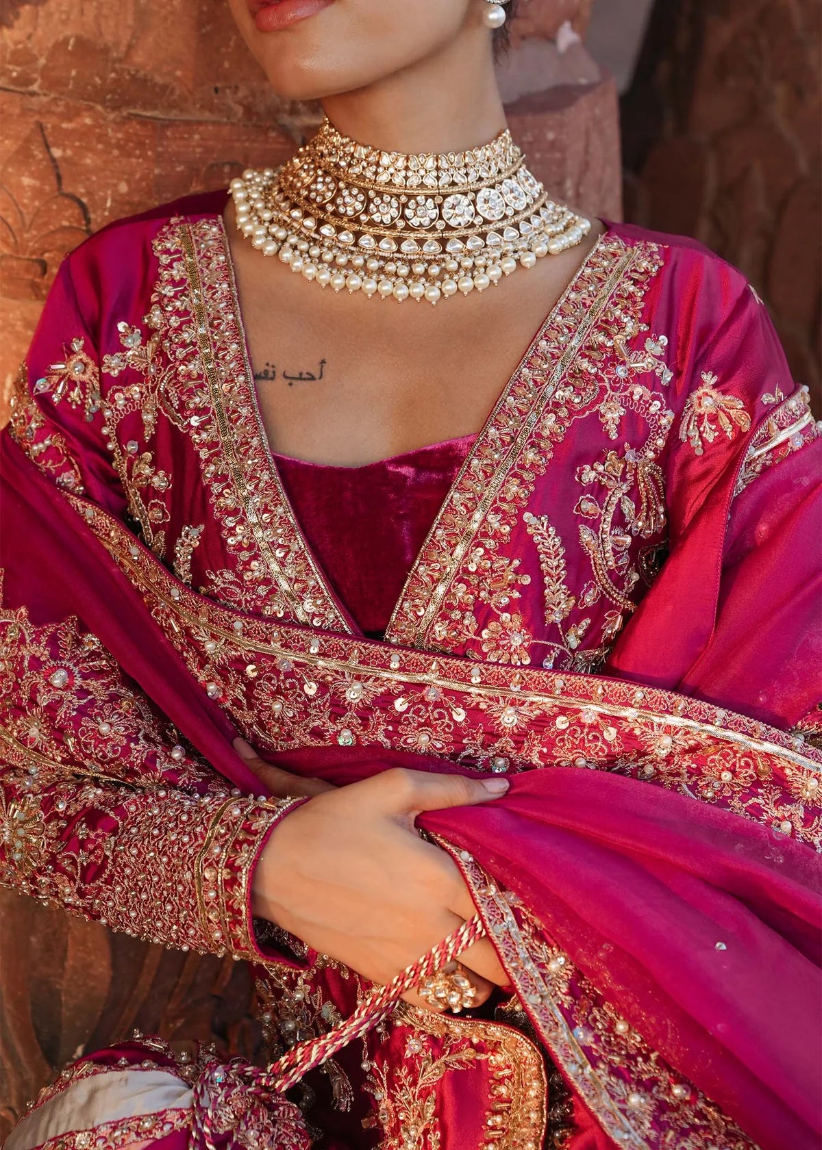 INAZAR – Fuchsia bridal lehenga suit with velvet lehenga, silk shirt, and embroidered dupatta. Stitched wedding outfit online at Pakistanimoda.