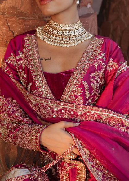 INAZAR – Fuchsia bridal lehenga suit with velvet lehenga, silk shirt, and embroidered dupatta. Stitched wedding outfit online at Pakistanimoda.