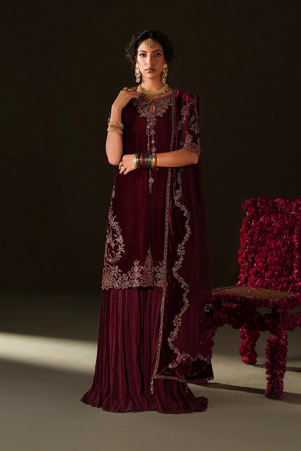 Iznik Velvet Edit II IV-71 maroon embroidered velvet formal sharara dress with chiffon dupatta and raw silk bottom, available at Pakistanimoda.