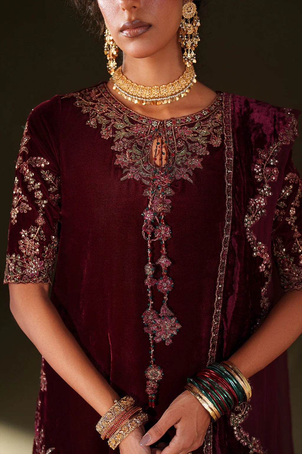 Iznik Velvet Edit II IV-71 maroon embroidered velvet formal sharara dress with chiffon dupatta and raw silk bottom, available at Pakistanimoda.