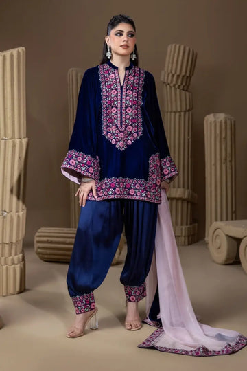 Indigo Garden midnight navy velvet stitched suit with pink resham floral embroidery, pure raw silk dhoti shalwar and chiffon dupatta.