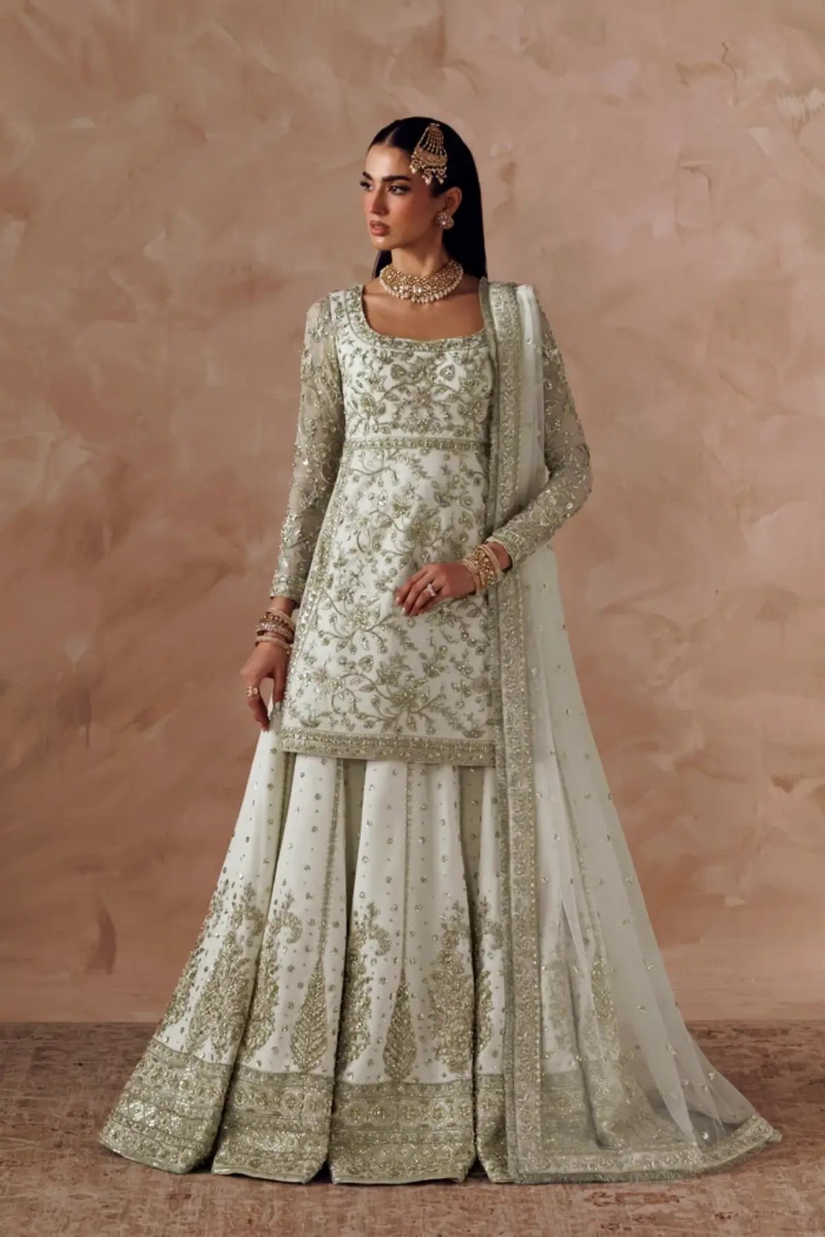 Ismara white embroidered net formal stitched lehenga dress with matching net dupatta from Riwayat Bridal Edit 26