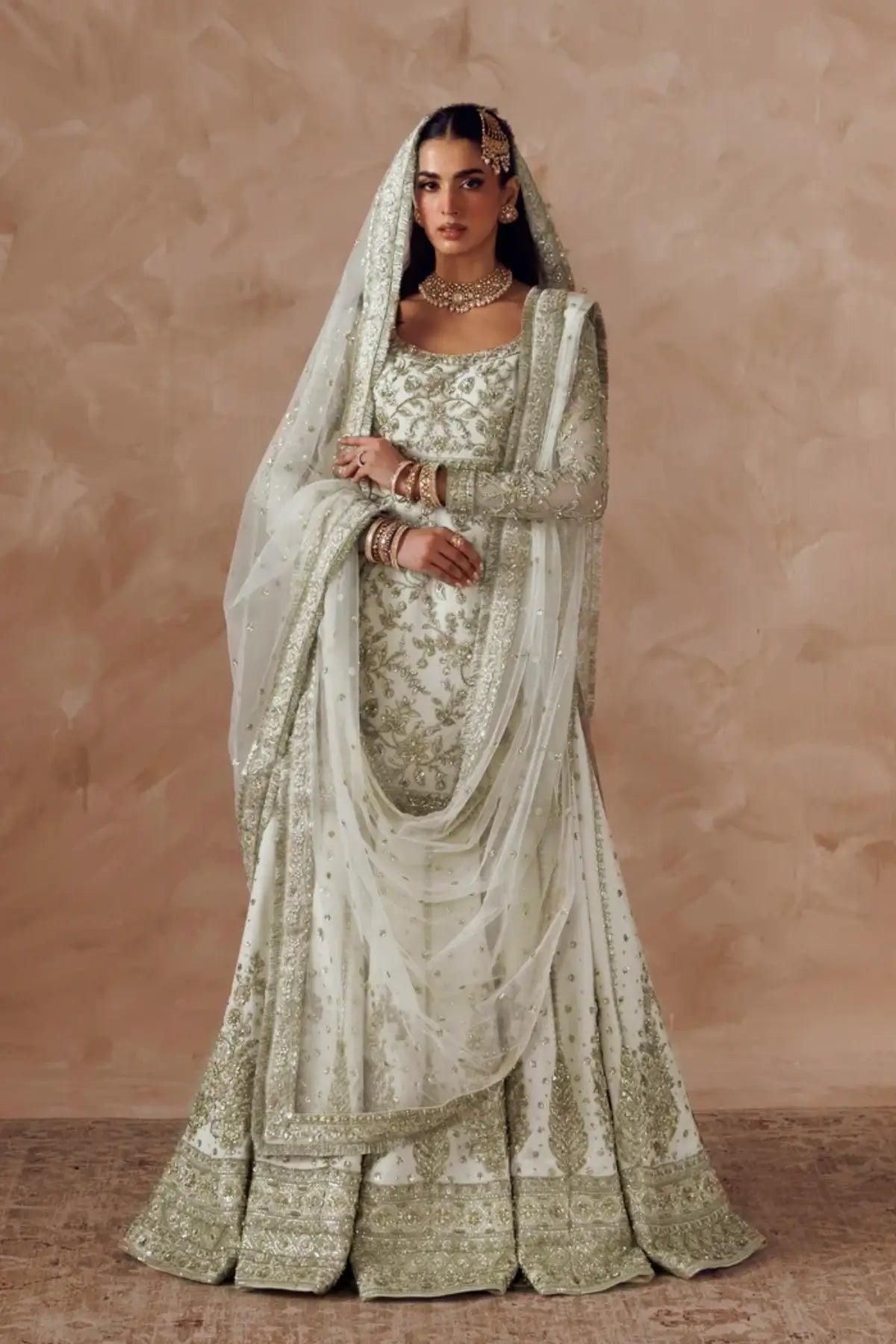 Ismara white embroidered net formal stitched lehenga dress with matching net dupatta from Riwayat Bridal Edit 26