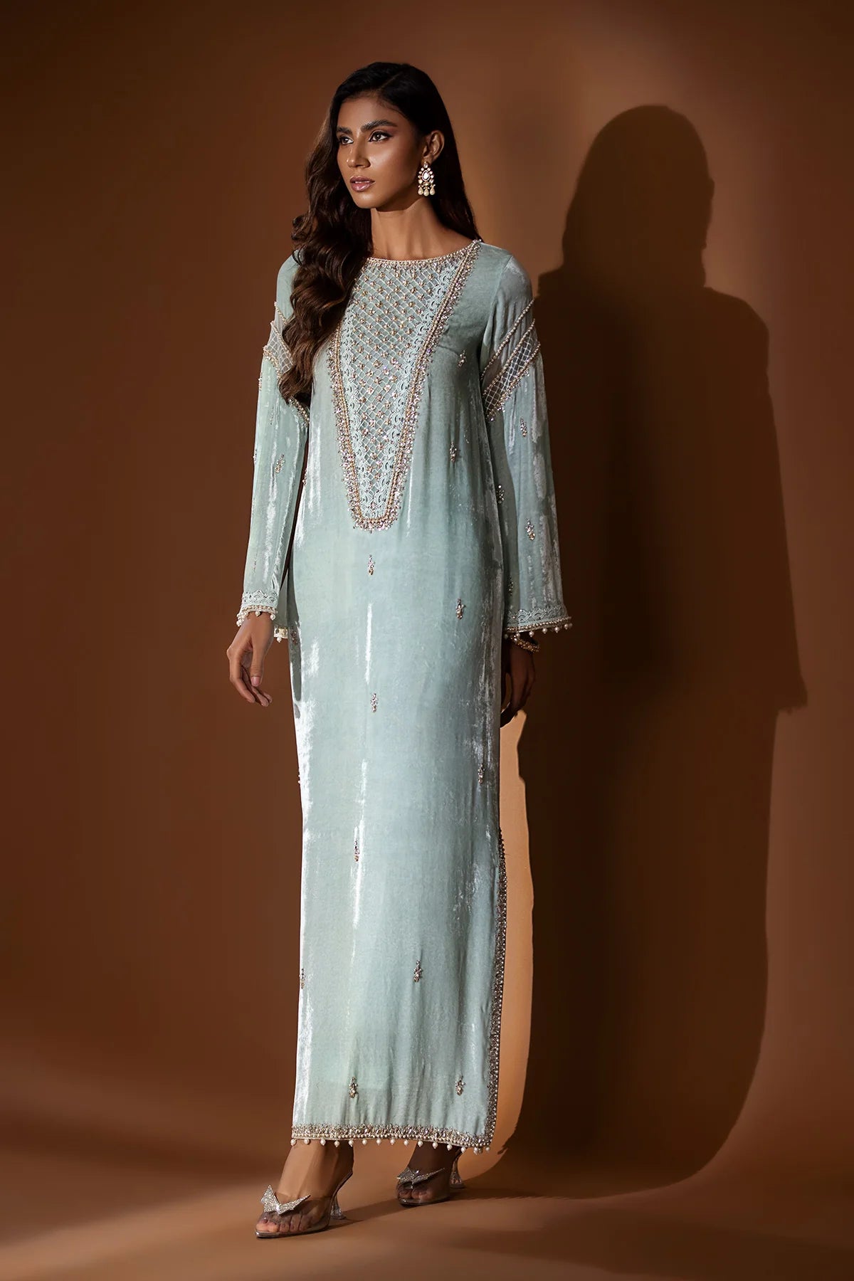 Ice blue velvet embroidered shirt with gold dabka and pearls, slit sleeves with pearl hangings, silk pants, and matching organza dupatta – formal 2025.