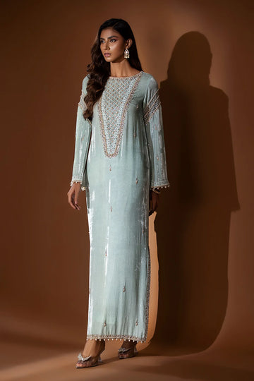 Ice blue velvet embroidered shirt with gold dabka and pearls, slit sleeves with pearl hangings, silk pants, and matching organza dupatta – formal 2025.