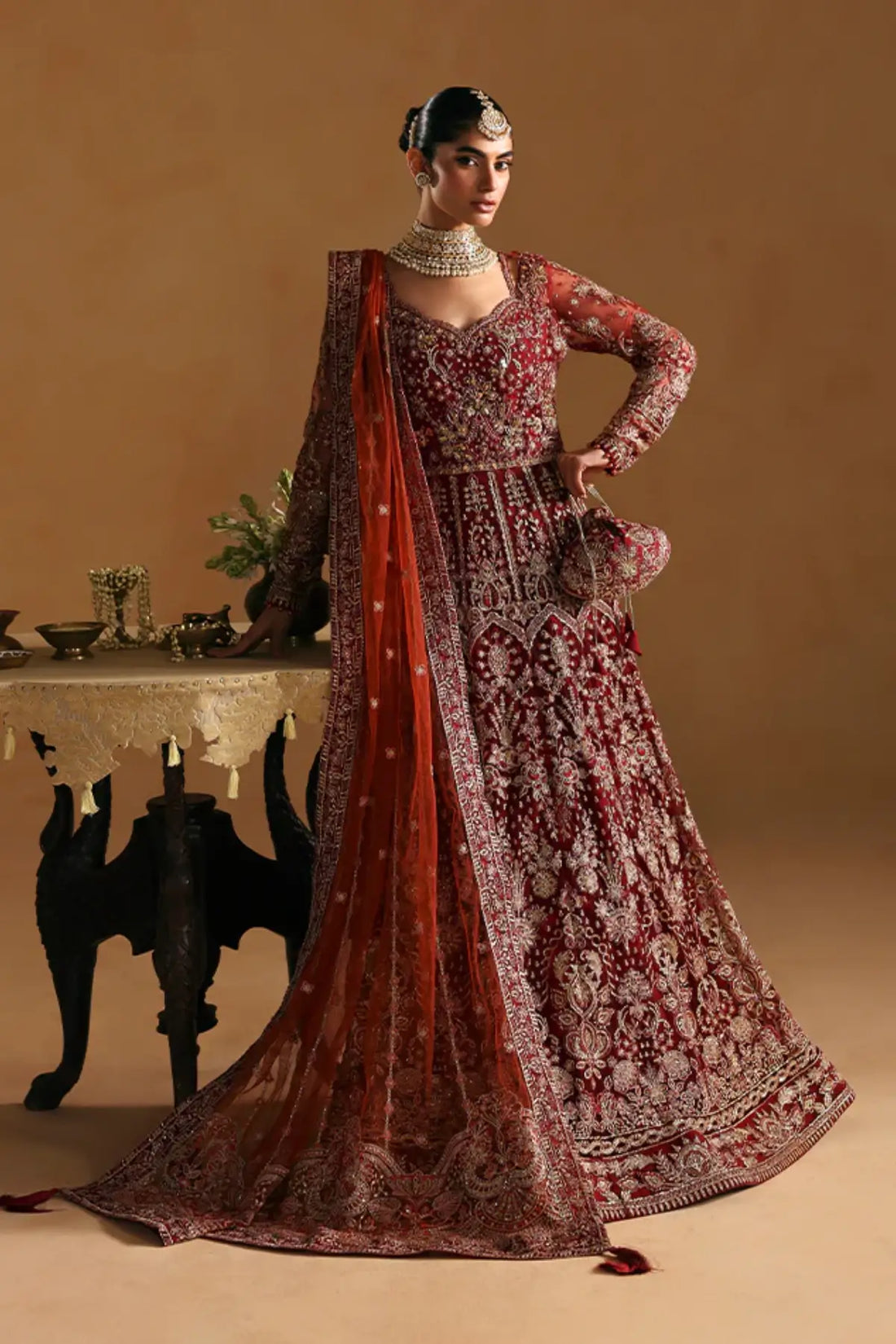 Jahari by Gulaal crimson red net pishwas with raw silk lehenga stitched and available online at Pakistanimoda.