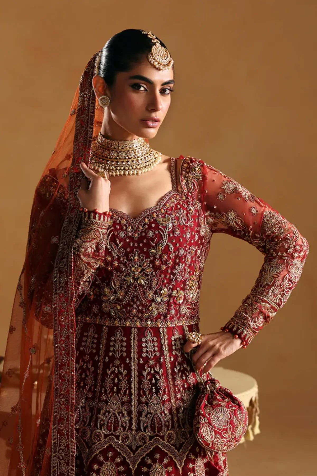 Jahari by Gulaal crimson red net pishwas with raw silk lehenga stitched and available online at Pakistanimoda.
