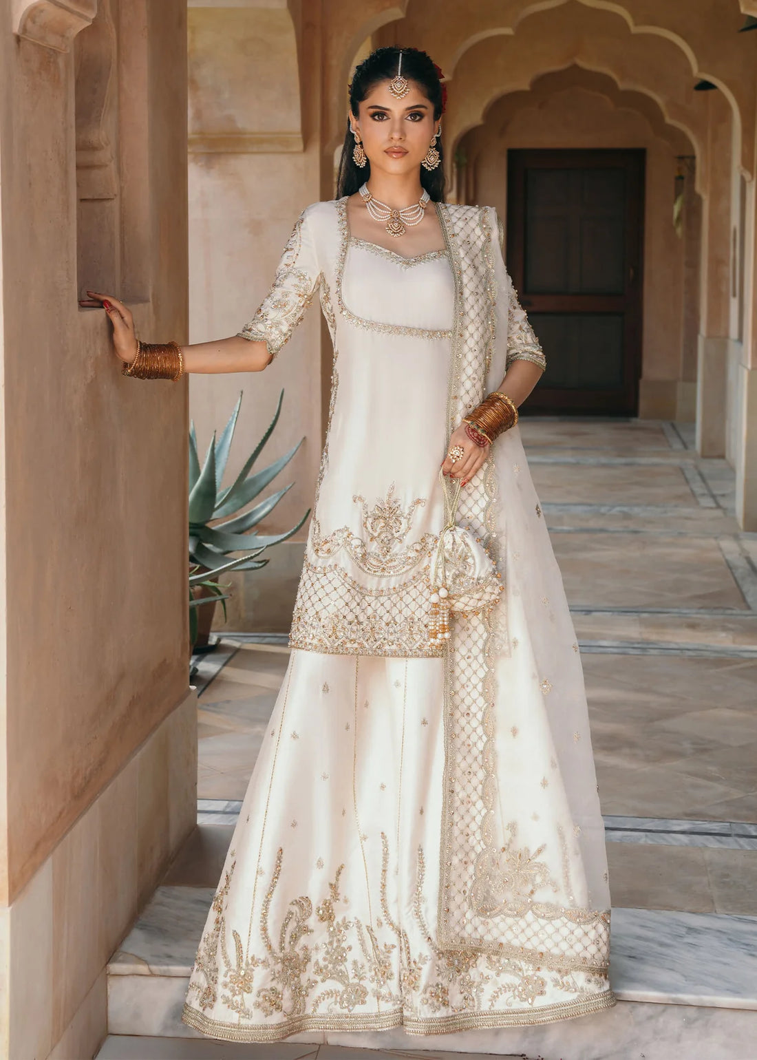 Jaya ivory embroidered Korean silk outfit with silk pants and embroidered organza dupatta by Kanwal Malik from the Saheli Luxury Pret Collection.