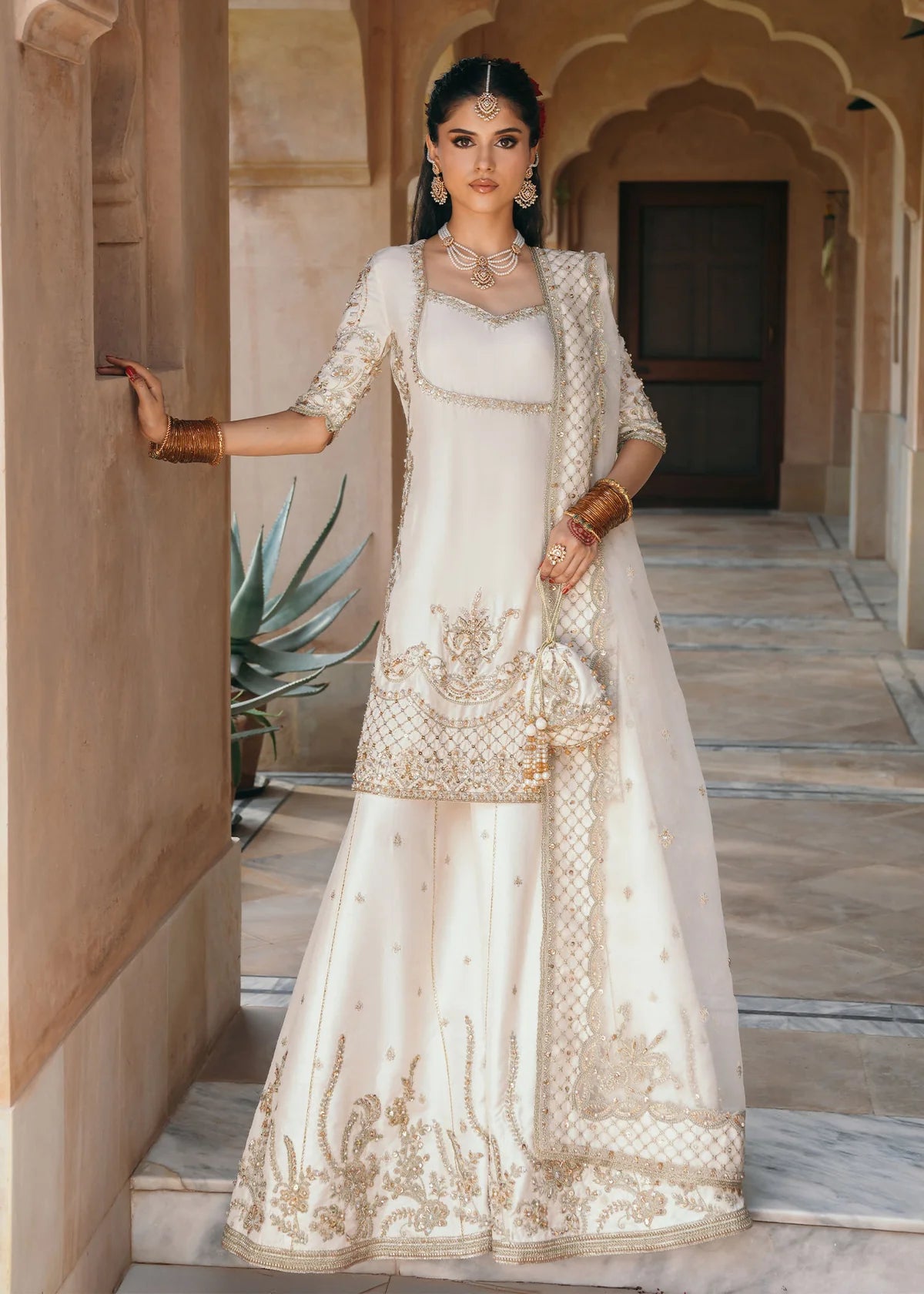 Jaya ivory embroidered Korean silk outfit with silk pants and embroidered organza dupatta by Kanwal Malik from the Saheli Luxury Pret Collection.