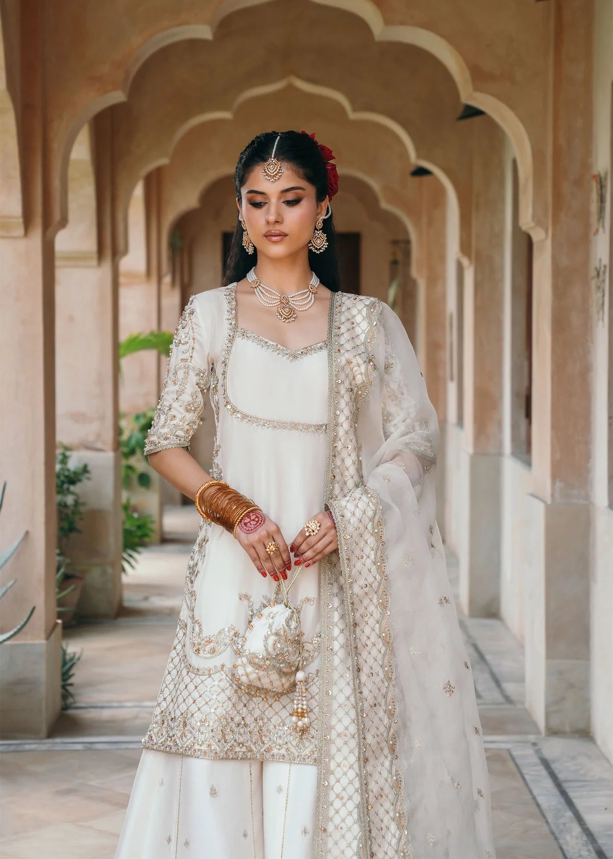 Jaya ivory embroidered Korean silk outfit with silk pants and embroidered organza dupatta by Kanwal Malik from the Saheli Luxury Pret Collection.