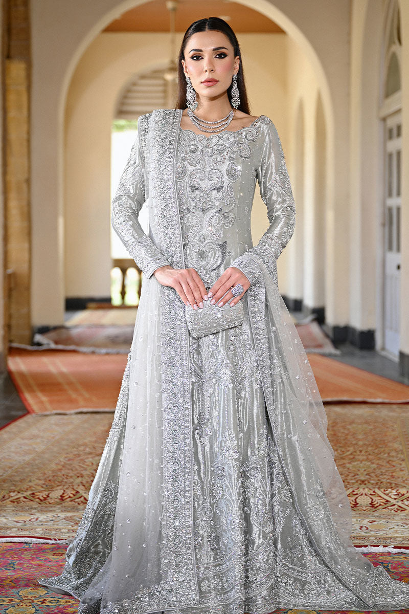 Silver Pakistani bridal mermaid gown with train, cutwork neckline, and embellished net dupatta – perfect for brides in USA, UK, and Canada.
