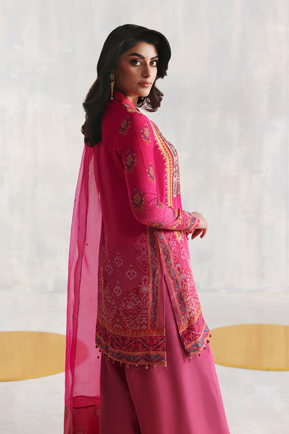 Shocking pink Pakistani printed grip shirt with Korean silk pants and organza dupatta – festive Eid outfit for women in USA, UK, and Canada.