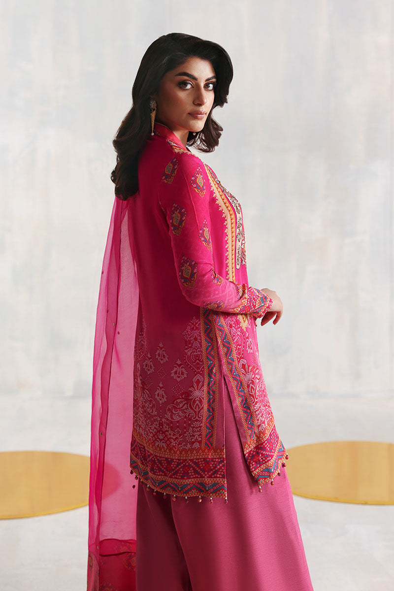 Shocking pink Pakistani printed grip shirt with Korean silk pants and organza dupatta – festive Eid outfit for women in USA, UK, and Canada.