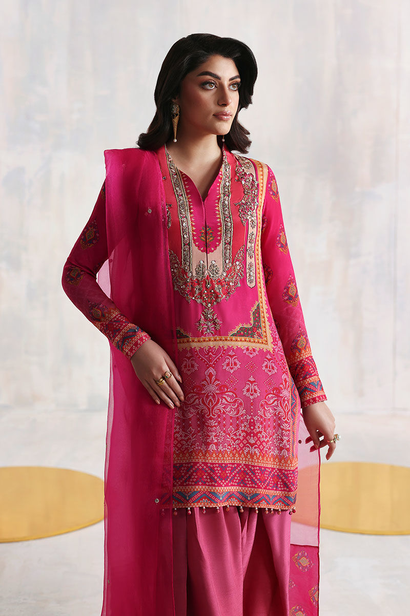 Shocking pink Pakistani printed grip shirt with Korean silk pants and organza dupatta – festive Eid outfit for women in USA, UK, and Canada.