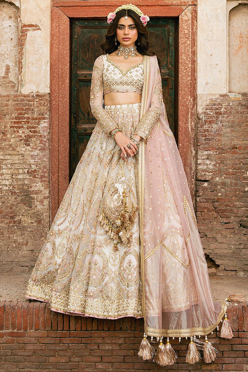 Kohinoor MNR off-white bridal lehenga with embellished organza panels and jacquard dupatta, stitched and available at Pakistanimoda for UK brides.