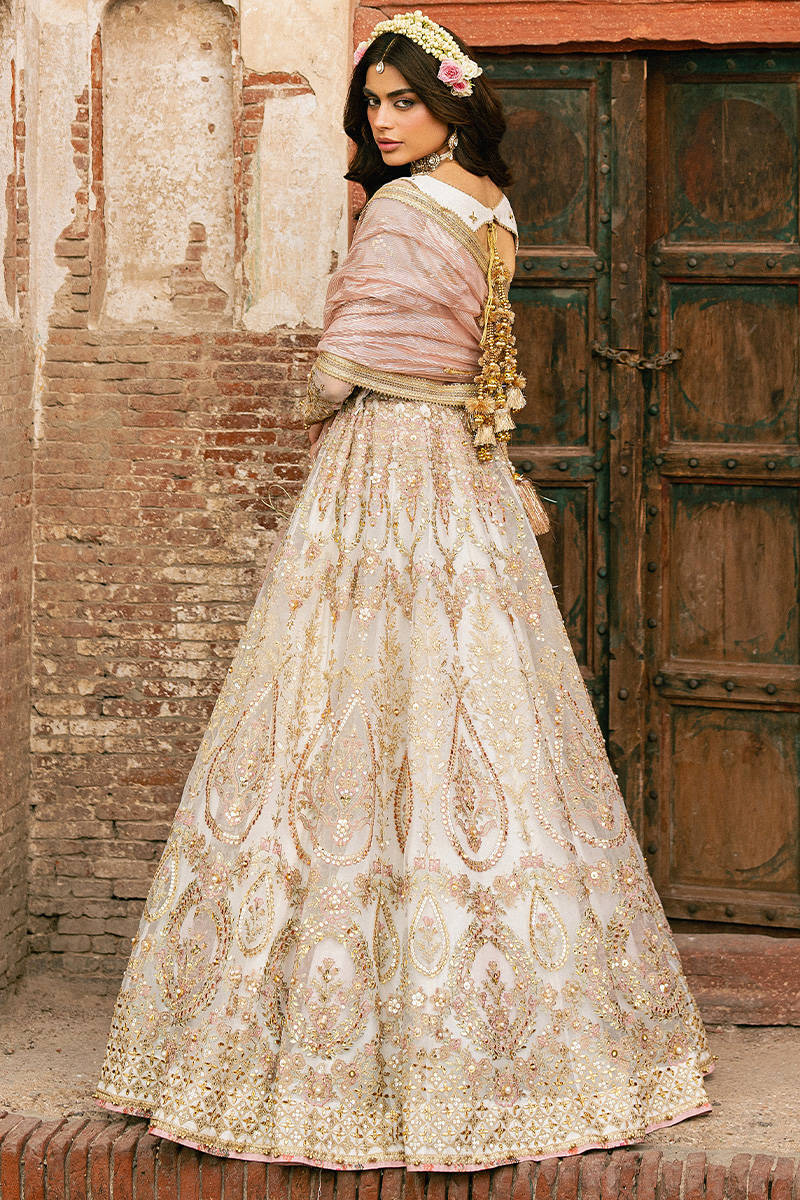 Kohinoor MNR off-white bridal lehenga with embellished organza panels and jacquard dupatta, stitched and available at Pakistanimoda for UK brides.