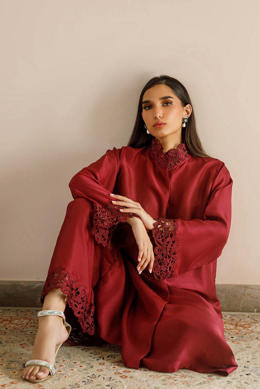 Maroon raw silk dress with cutwork embroidery and pizza-cut design.