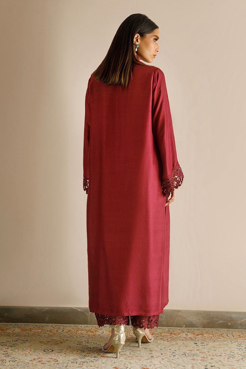 Maroon raw silk dress with cutwork embroidery and pizza-cut design.