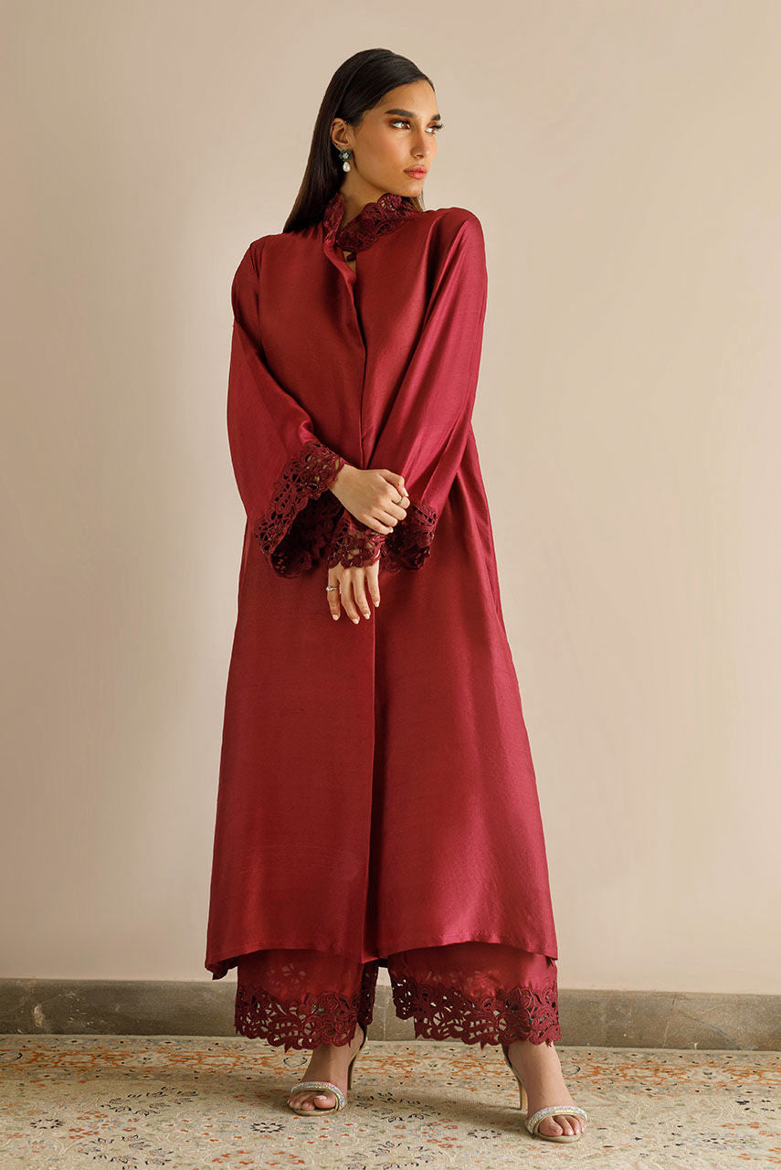 Maroon raw silk dress with cutwork embroidery and pizza-cut design.
