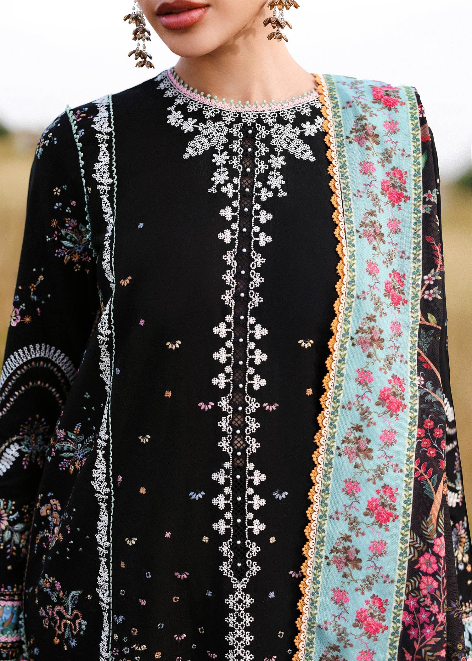 Hussain Rehar Malika black embroidered khaddar stitched winter suit with printed wool shawl at Pakistanimoda.