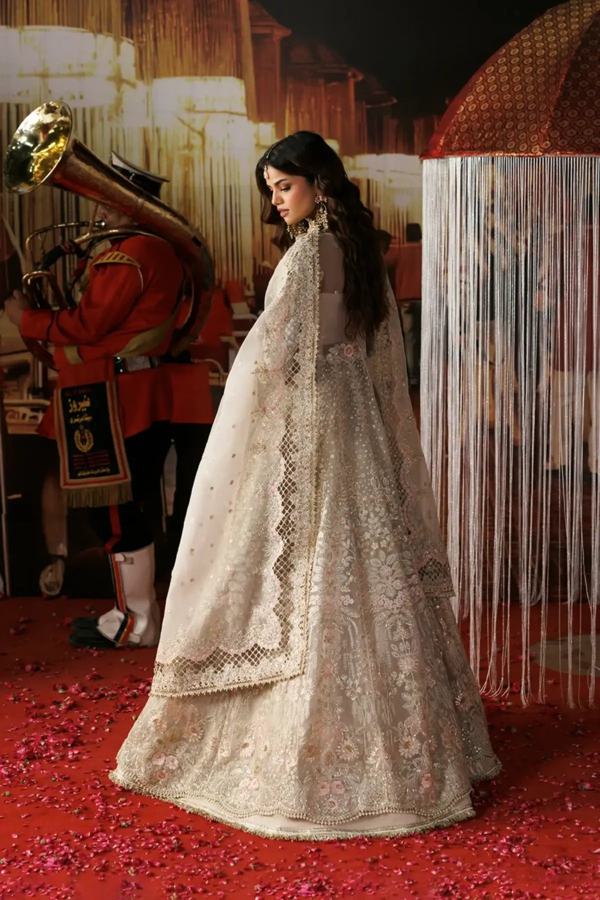 Mannat skin embellished organza stitched bridal Peshwas with silver floral embroidery, zari trouser and detailed organza dupatta