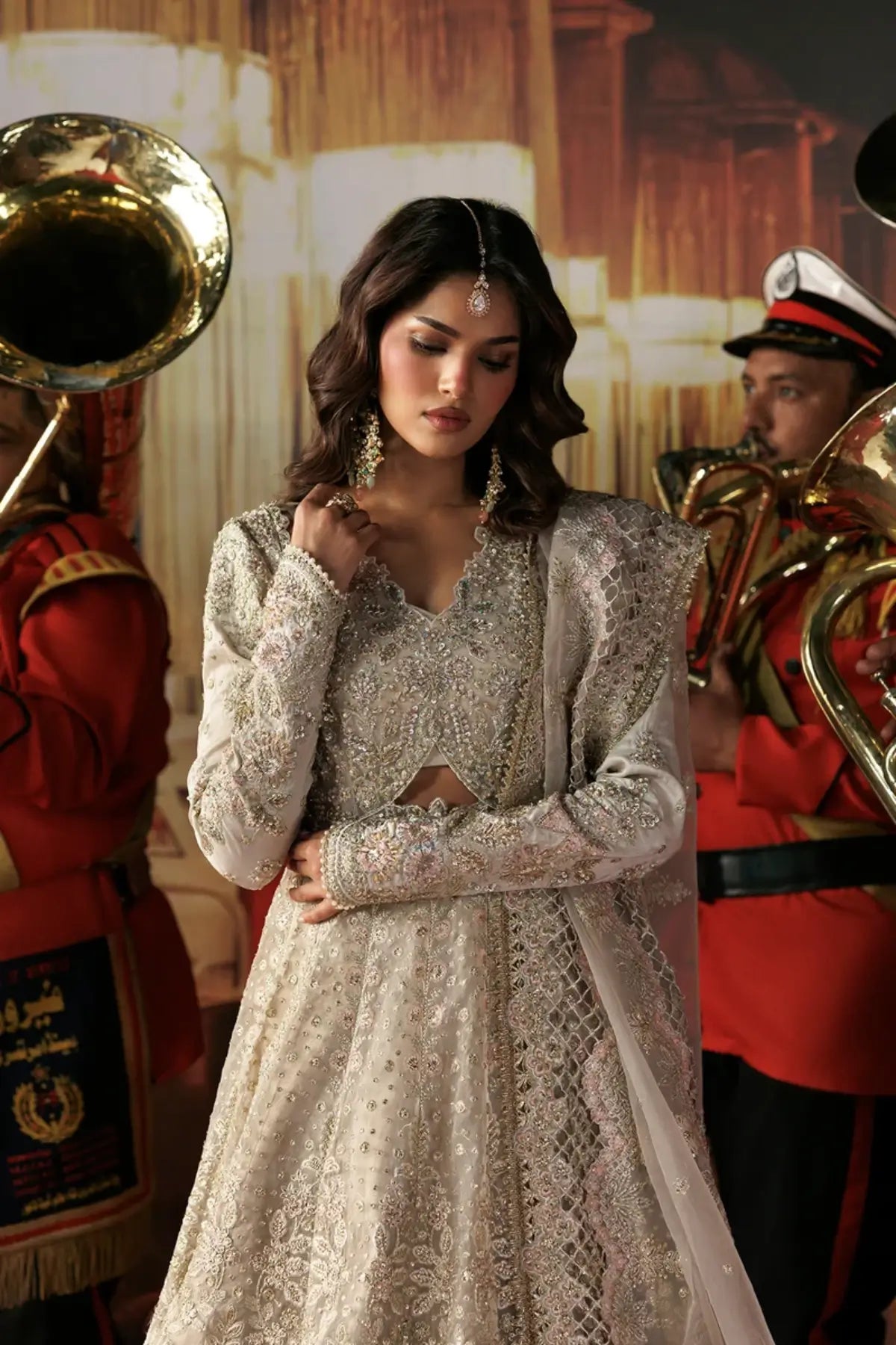 Mannat skin embellished organza stitched bridal Peshwas with silver floral embroidery, zari trouser and detailed organza dupatta