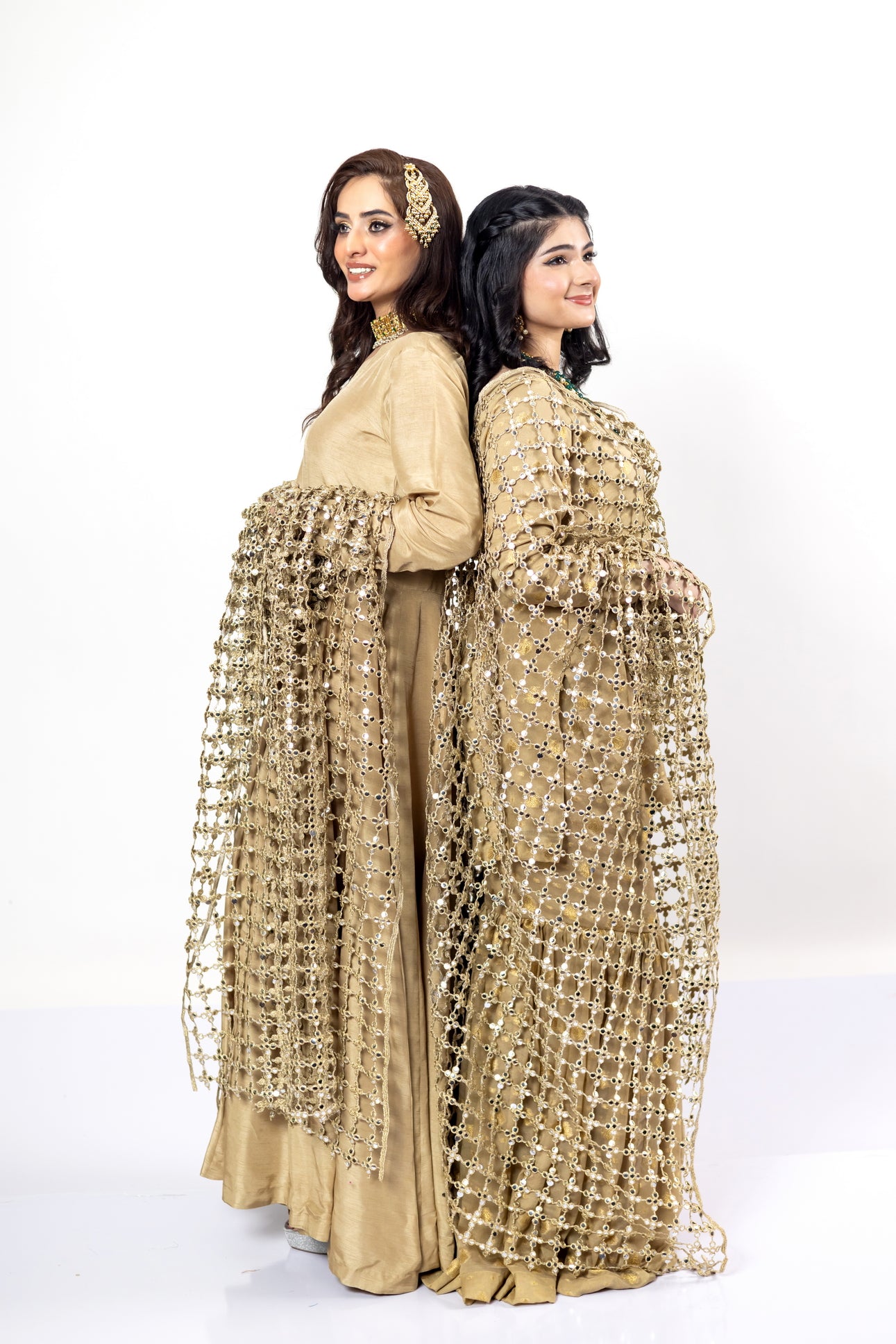 Gold Designer Frock & Gharara Set by MariamRaj with zardoze and resham embroidery for weddings and mehndi.