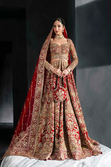 Heavily embroidered red bridal lehenga with gold floral work, full sleeves, and dupatta – perfect for Pakistani brides on Nikkah or Baraat.