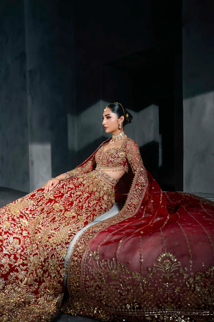 Heavily embroidered red bridal lehenga with gold floral work, full sleeves, and dupatta – perfect for Pakistani brides on Nikkah or Baraat.