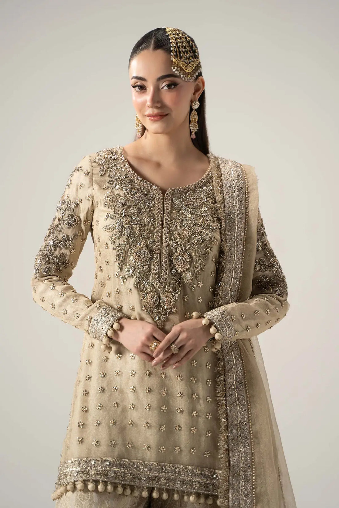 Mayrozeh gold and cream embellished gharara set with zari net shirt, jamawar gharara and dupatta by Maria B