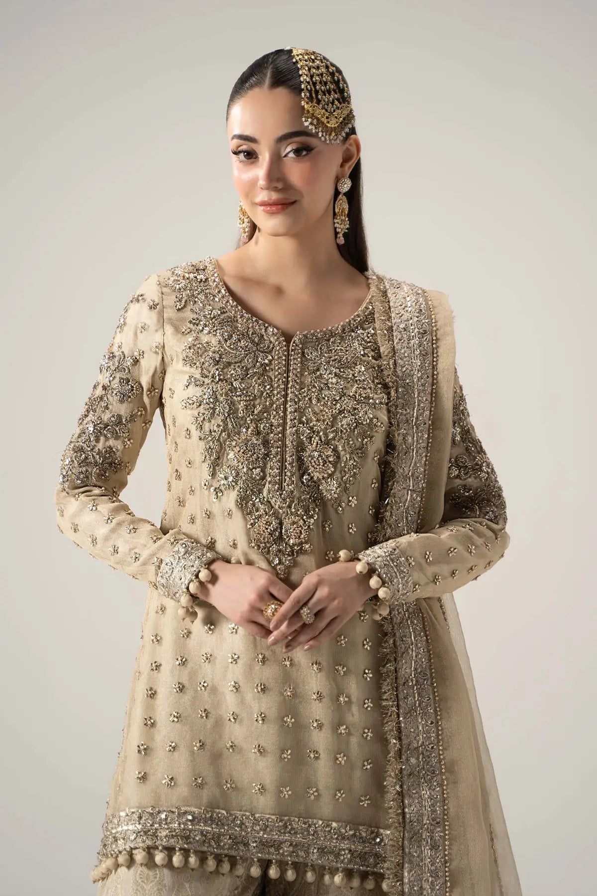 Mayrozeh gold and cream embellished gharara set with zari net shirt, jamawar gharara and dupatta by Maria B