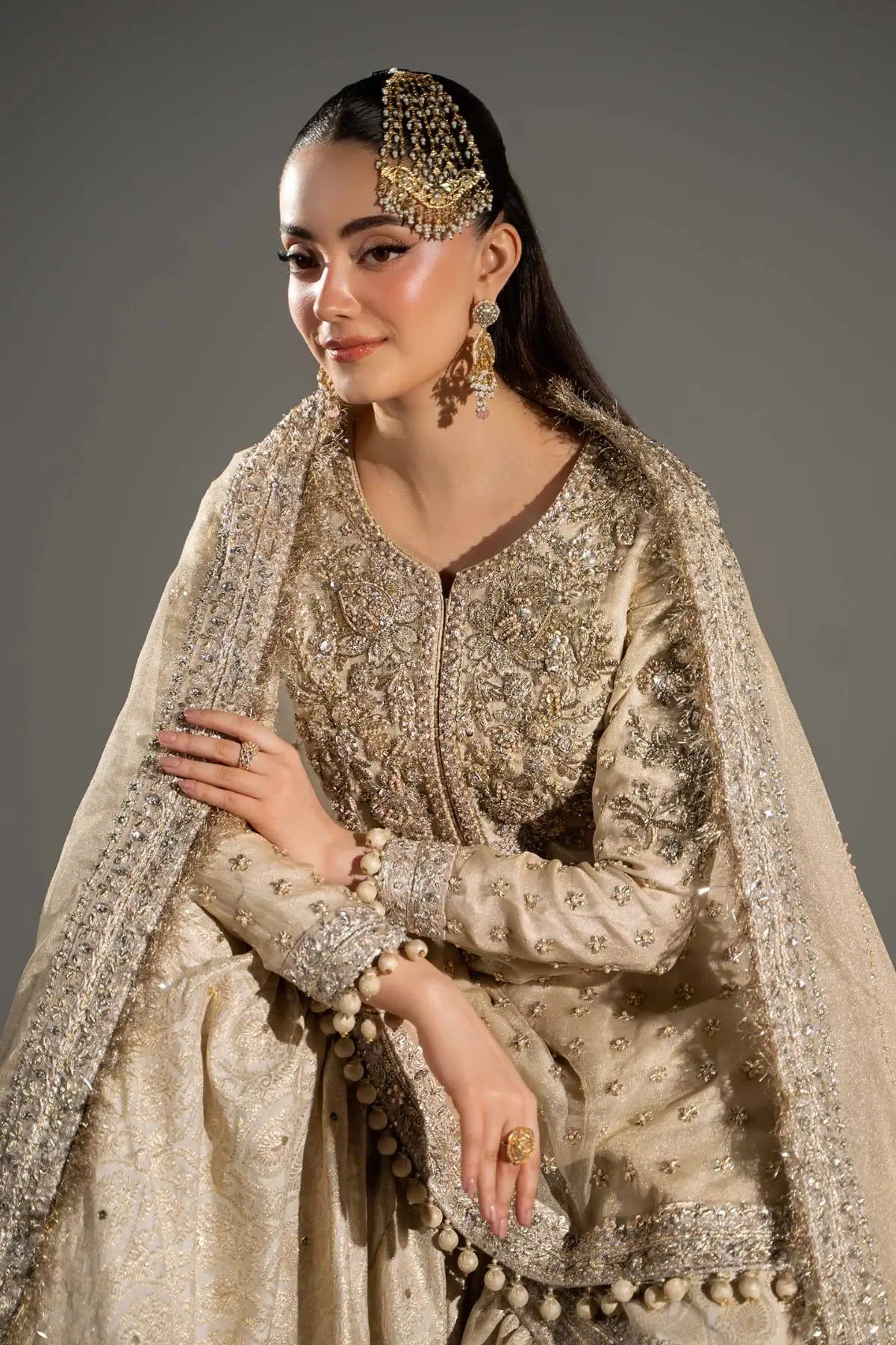 Mayrozeh gold and cream embellished gharara set with zari net shirt, jamawar gharara and dupatta by Maria B