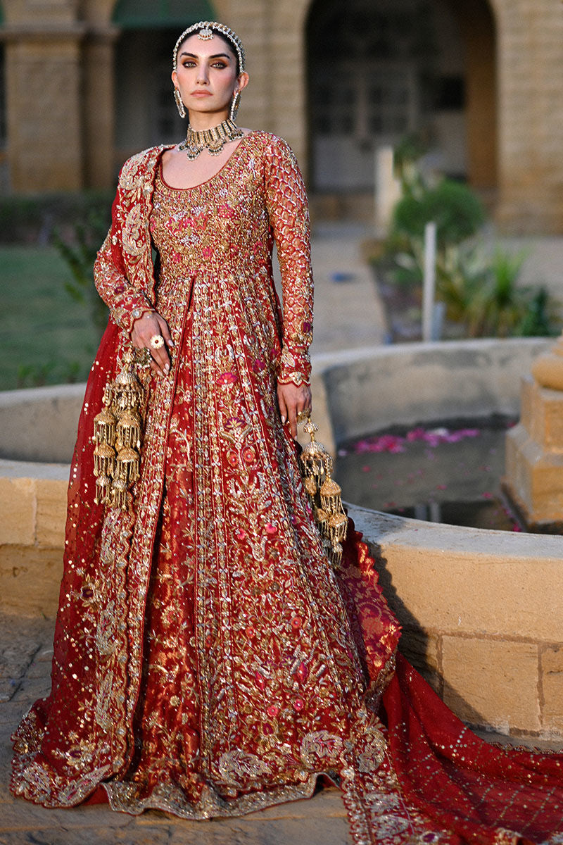 Crimson red Pakistani bridal lehenga with Mughal motifs, heavy hand embellishments, and jaal embroidered dupatta – perfect for brides in USA, UK, and Canada.