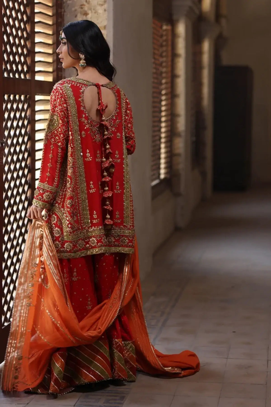 Meher Orange Handmade Silk Net Dholki Shirt with Gold Hand Embellishments, Raw Silk Wide Leg Pants, Silk Net Dupatta and Matching Pouch