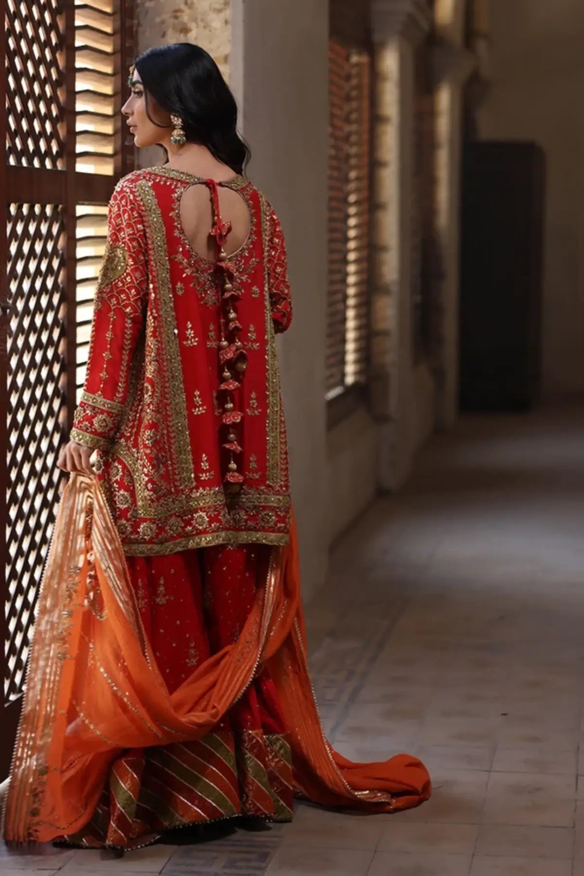 Meher Orange Handmade Silk Net Dholki Shirt with Gold Hand Embellishments, Raw Silk Wide Leg Pants, Silk Net Dupatta and Matching Pouch