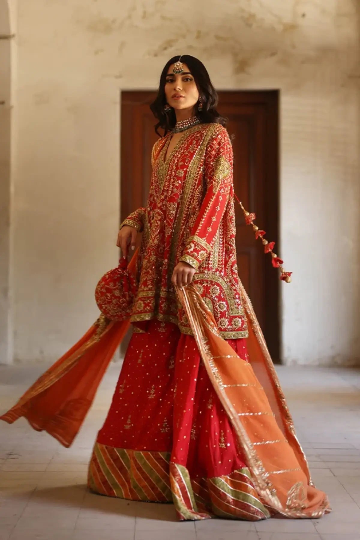 Meher Orange Handmade Silk Net Dholki Shirt with Gold Hand Embellishments, Raw Silk Wide Leg Pants, Silk Net Dupatta and Matching Pouch