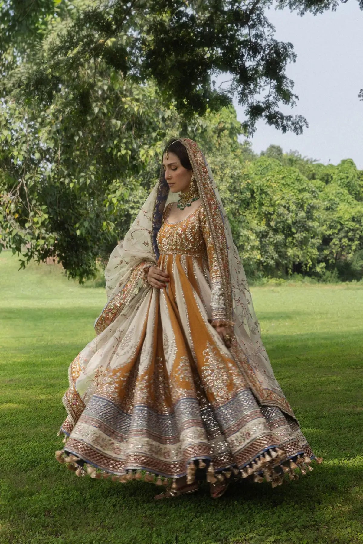 Mehru Hussain Rehar mustard raw silk stitched wedding Peshwas with indigo blue churidar and embroidered ivory organza dupatta