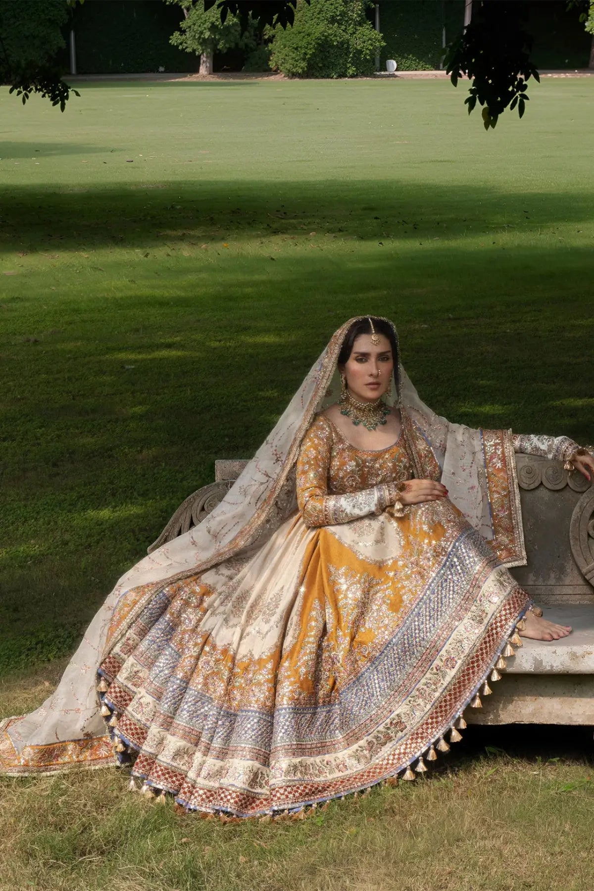 Mehru Hussain Rehar mustard raw silk stitched wedding Peshwas with indigo blue churidar and embroidered ivory organza dupatta