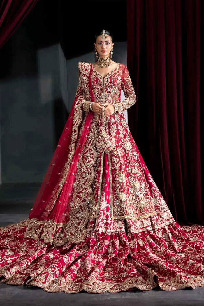 Deep crimson bridal lehenga with gold embroidery, full sleeves, flared skirt, and dramatic dupatta – perfect for overseas Pakistani and Indian brides.